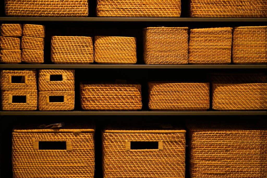 Japandi storage ideas for a small apartment with organized shelves and woven storage baskets