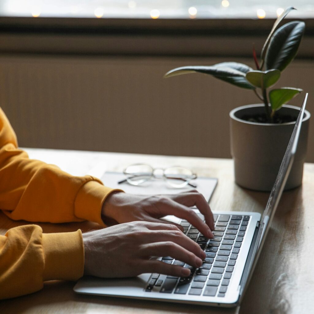 Digital workspace with laptop representing the Simple Living Digital Toolkit
