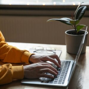Digital workspace with laptop representing the Simple Living Digital Toolkit
